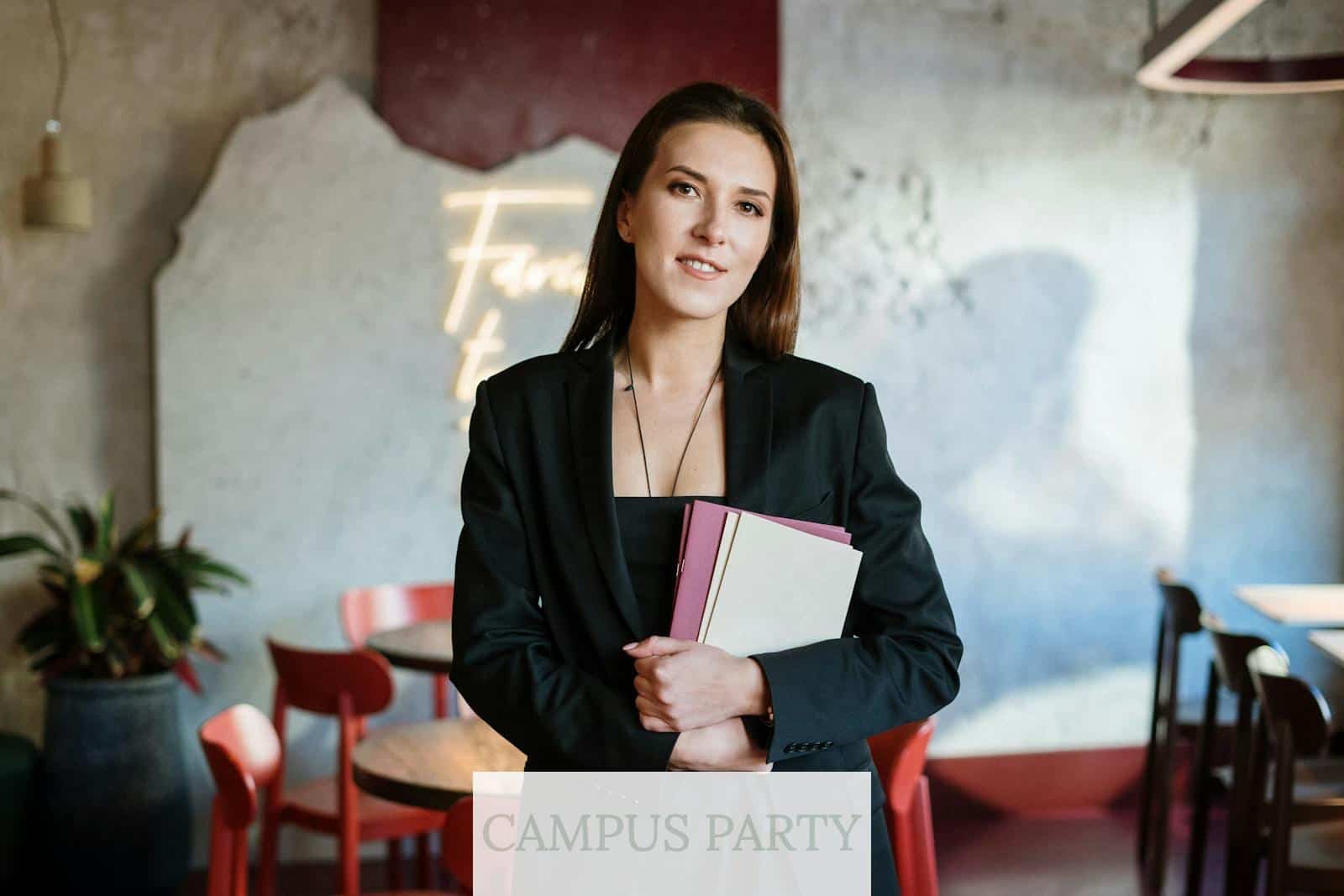 Woman in Black Blazer Holding White Paper