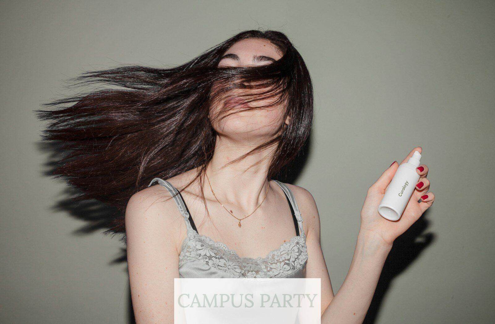 woman holding spray bottle